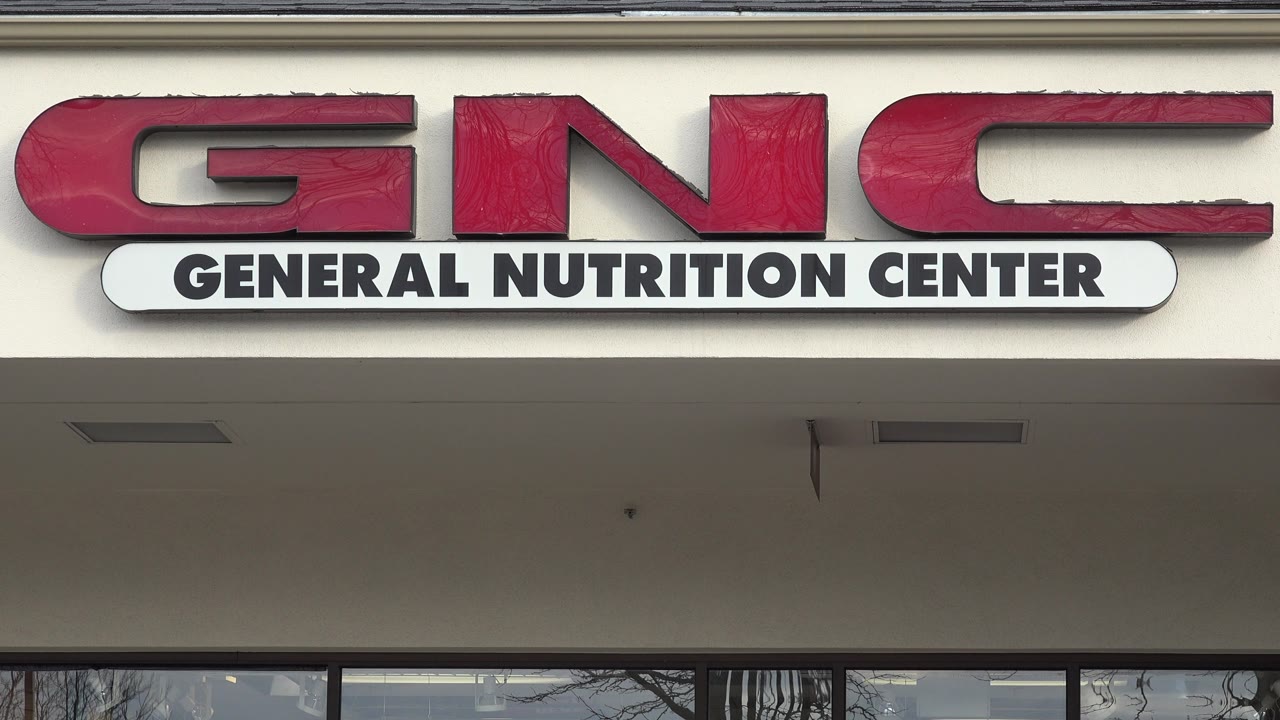 Close storefront sign for General Nutrition Center