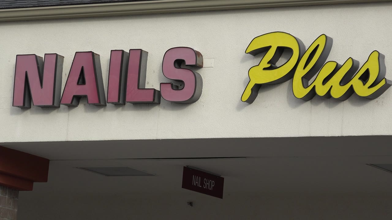 Second frame shows the Nails Plus sign in Westminster, Colorado, with the awning shadow and a small hanging nail shop sign below, no visible people.
