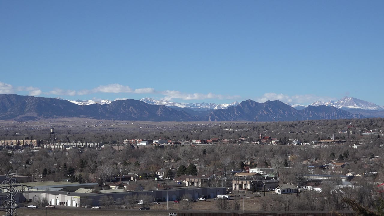 Clear sky and mountain horizon beyond low city development