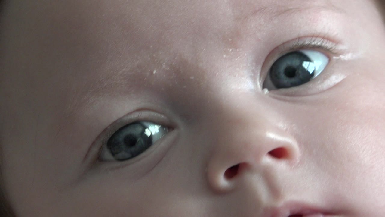 Close-up of a baby's eyes and nose filling the frame.