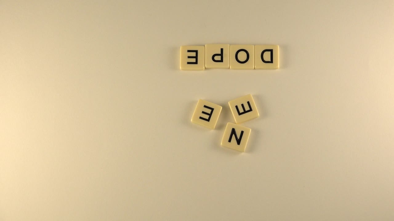 Second overhead frame in Westminster, Colorado, showing the DOPE tile row at the top and the loose E and N tiles grouped lower in the frame, with no visible people.