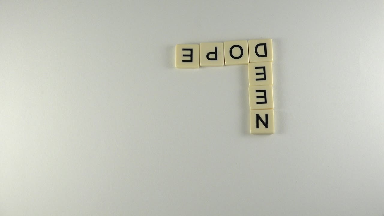 At 0:00, white letter tiles form a small inverted L on a pale surface in Westminster, Colorado, with no visible people.