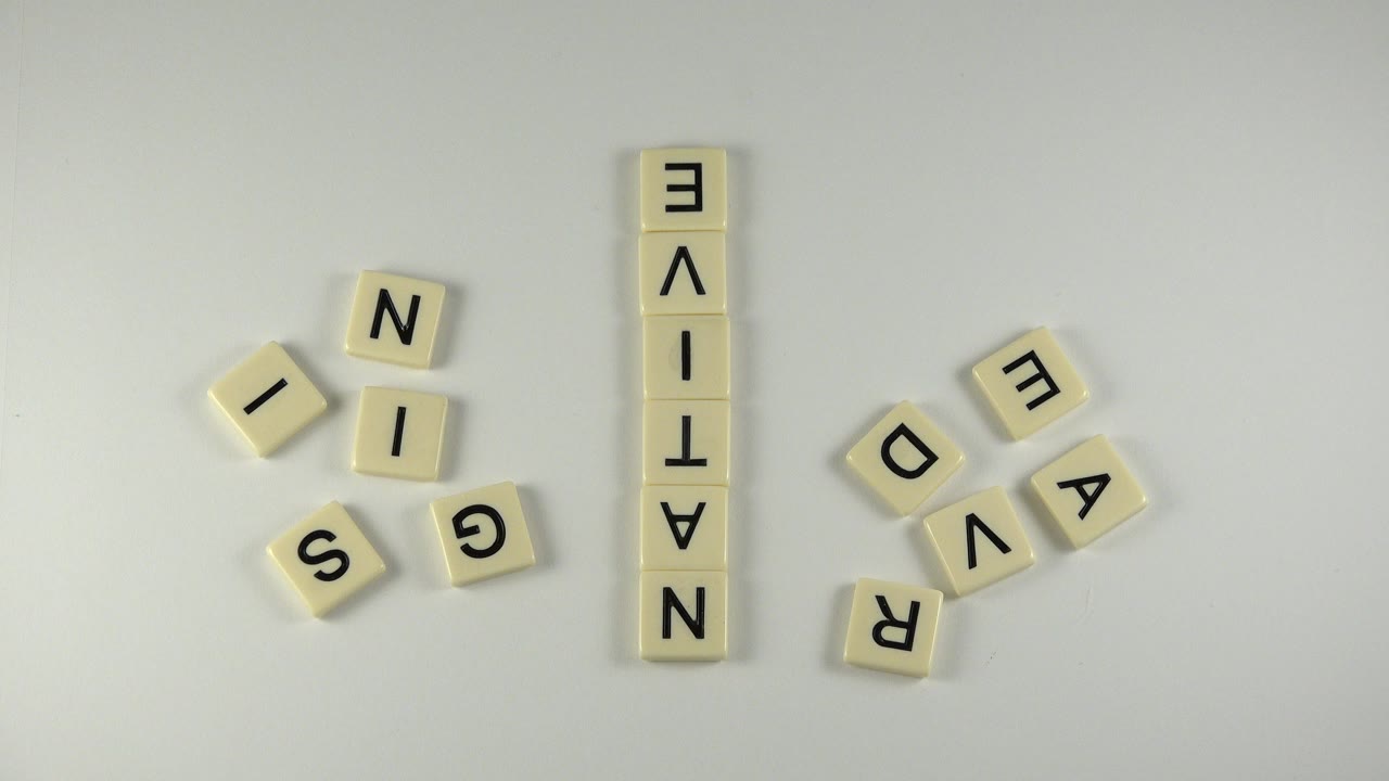 Letter tiles arranged on a pale tabletop.