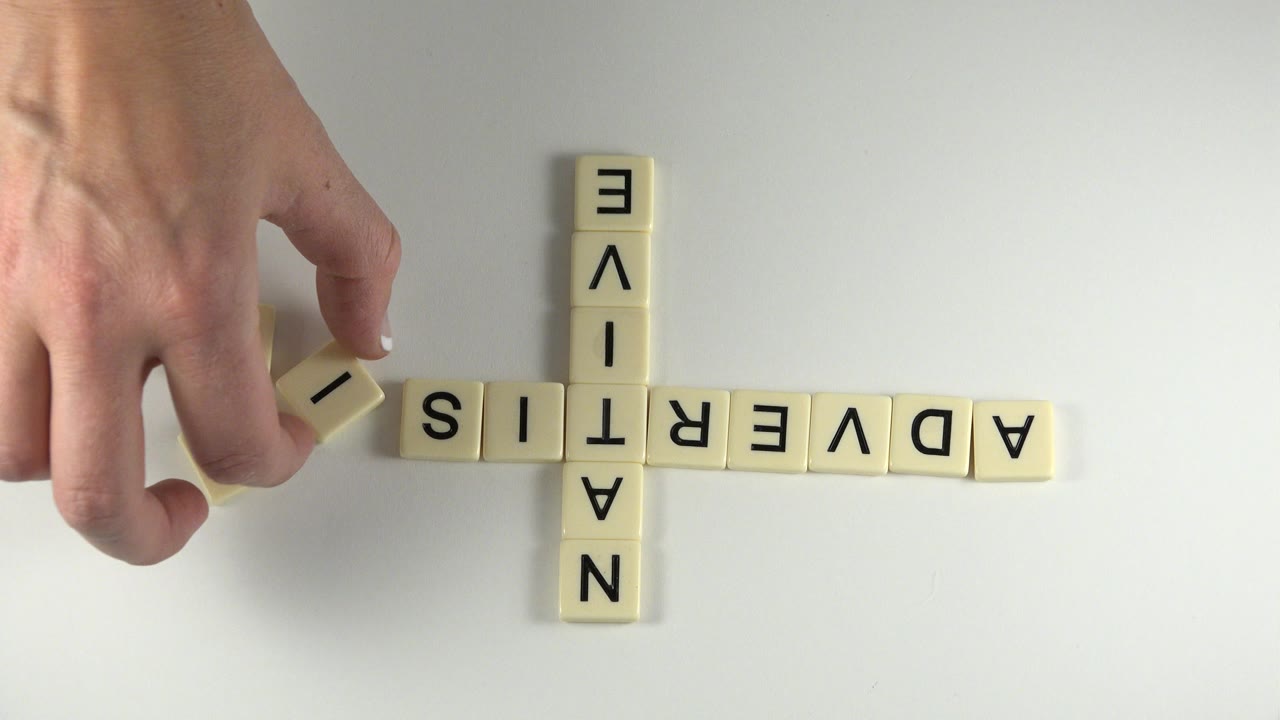 At 0:01 in Westminster, Colorado, the hand hovers over the left side of the horizontal ADVERTISING row while the vertical NATIVE tiles remain centered.