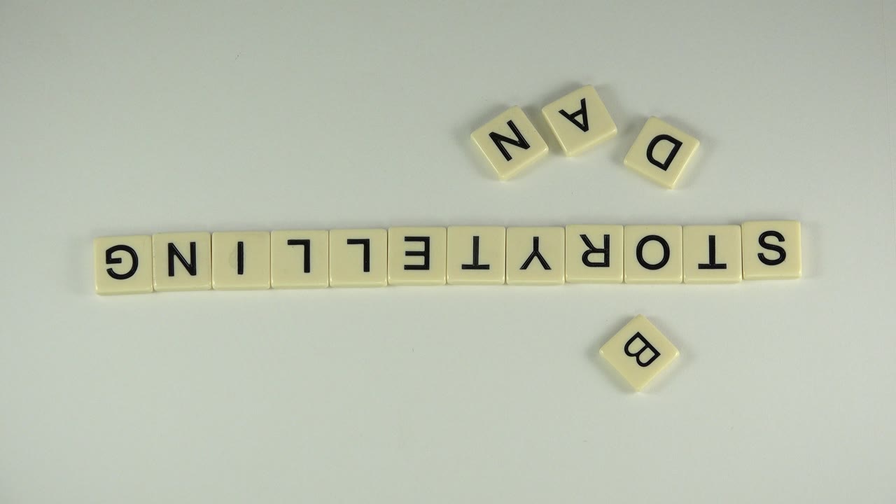 Westminster, Colorado frame with the upside-down STORYTELLING tile row centered horizontally, loose letters above and below it, and no visible people.