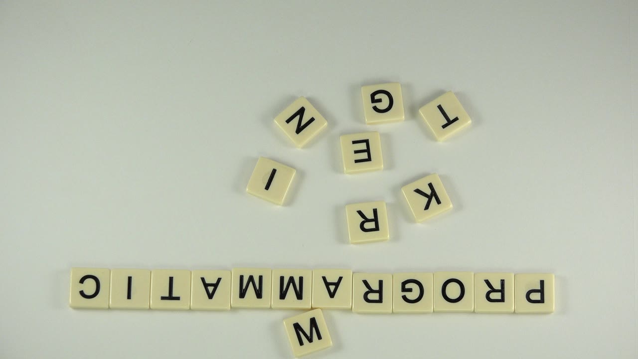 Letter tiles arranged on a pale tabletop.