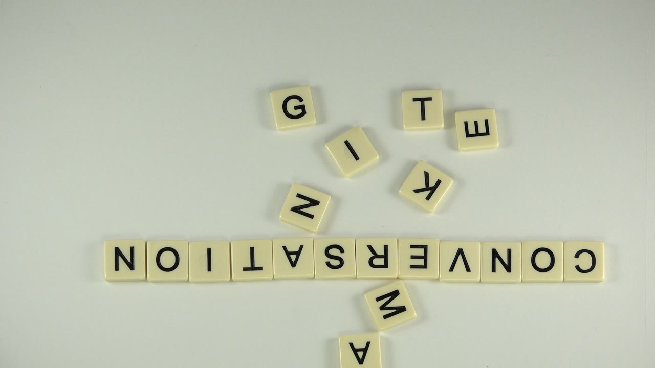 Letter tiles spelling CONVERSATION on a pale tabletop.