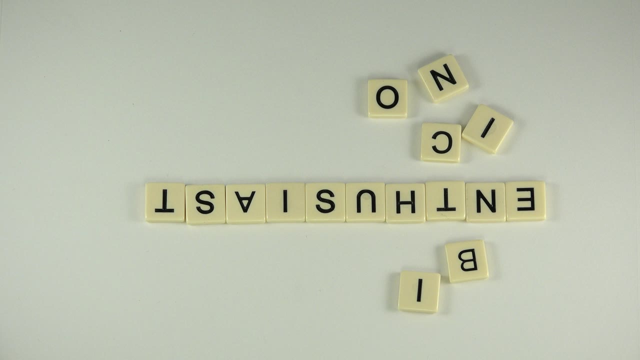 Letter tiles arranged on a pale tabletop with no visible people.