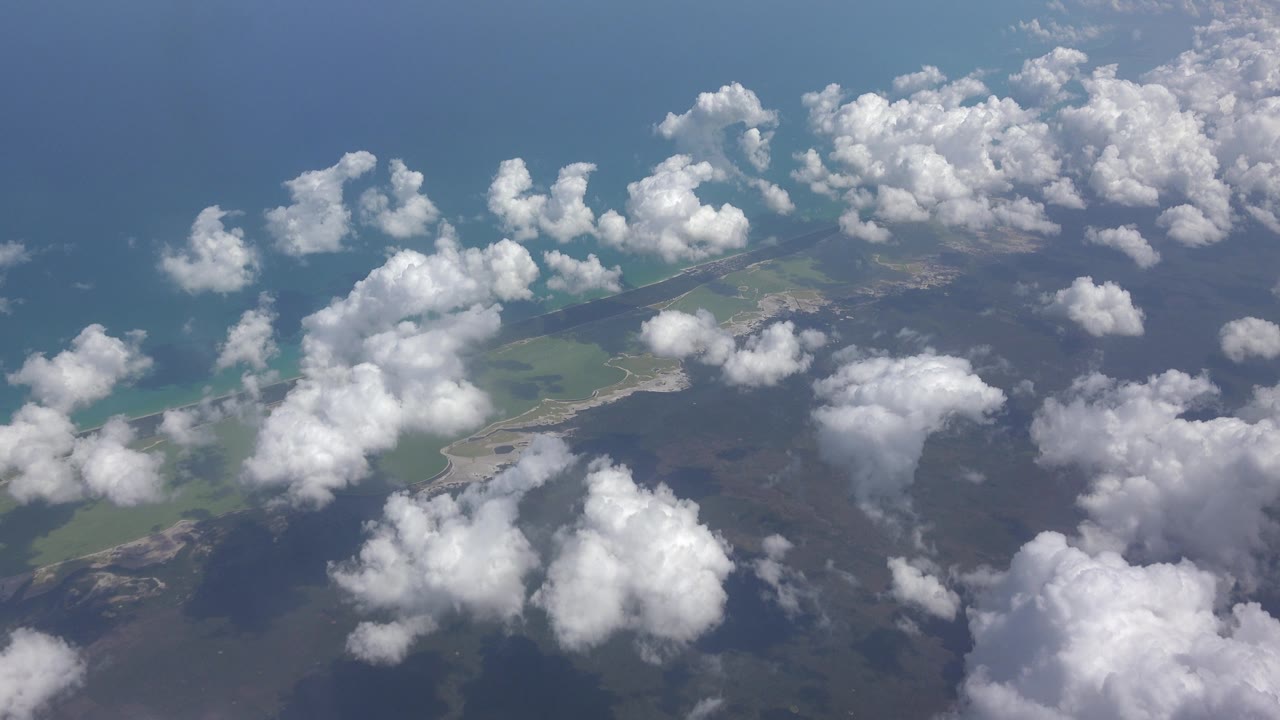 Plane-view clouds over water and land
