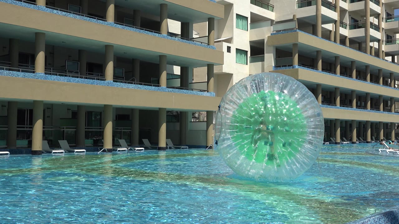 Inflatable water ball floating in a hotel pool