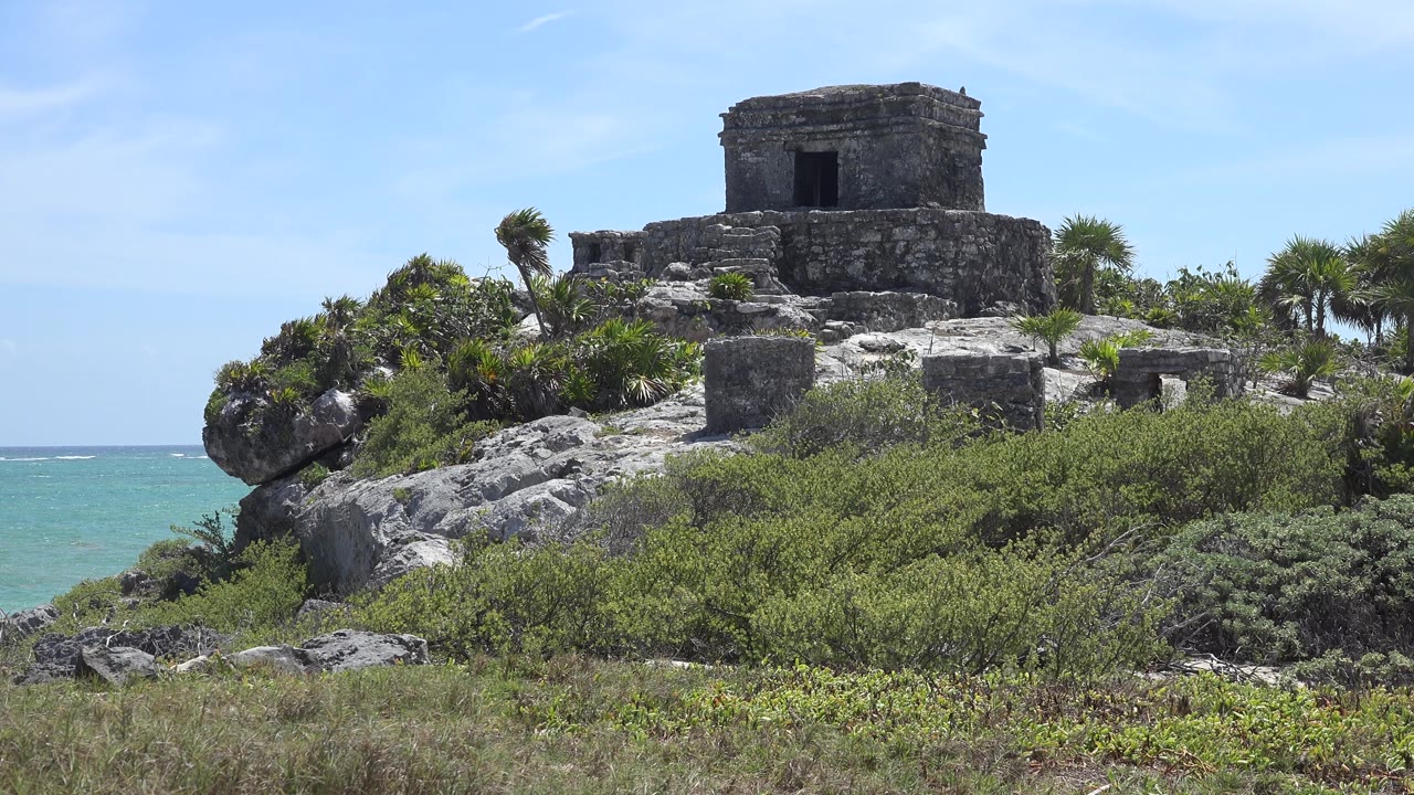 Old stone fortress above rocks and seaside brush