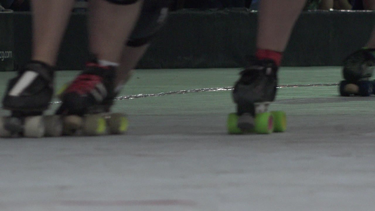 Close roller skates with bright green wheels near the right edge.