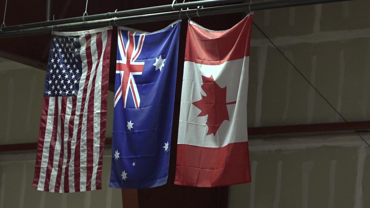 Vertical flags with red, white, and blue fabric folds