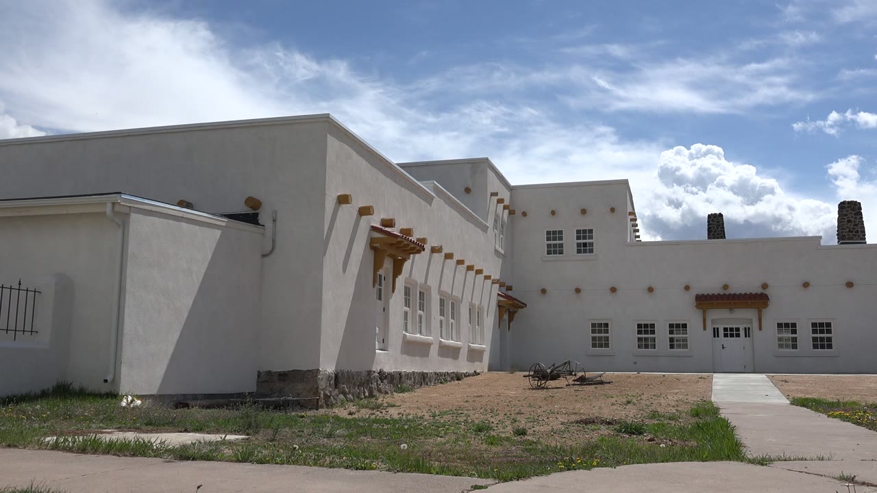 White stucco building facade under a bright sky