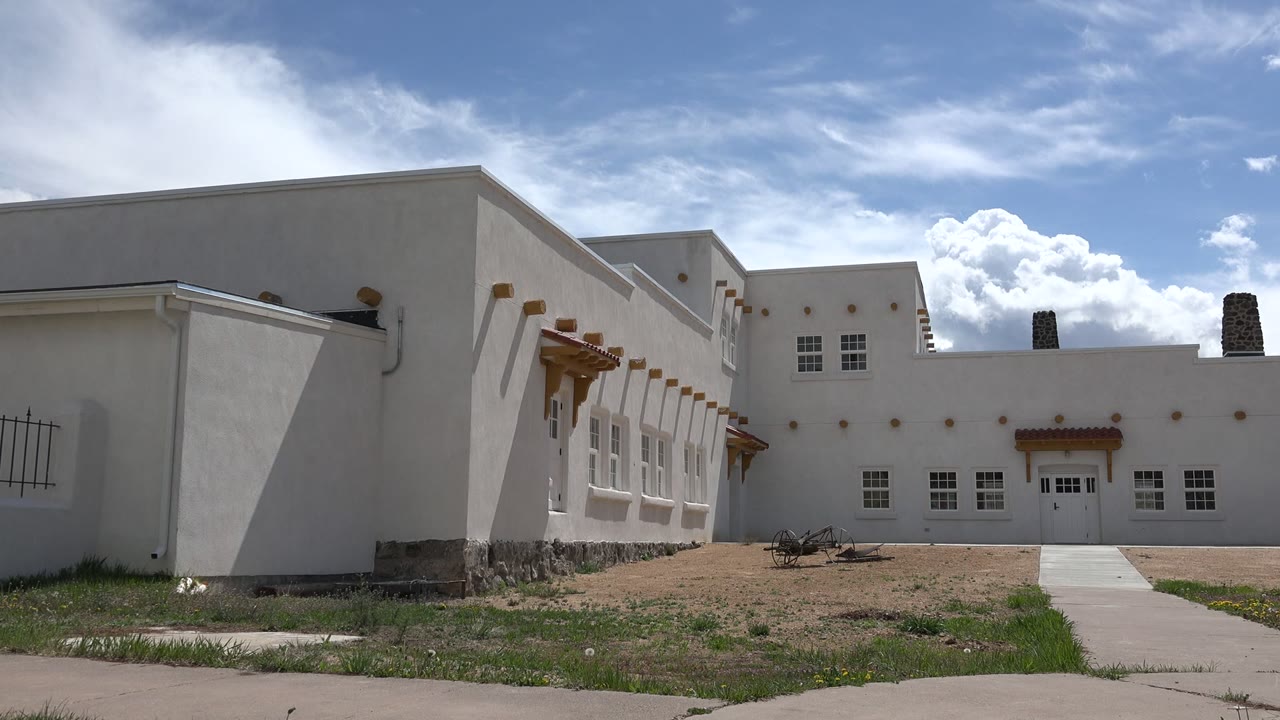 White stucco building exterior under blue sky