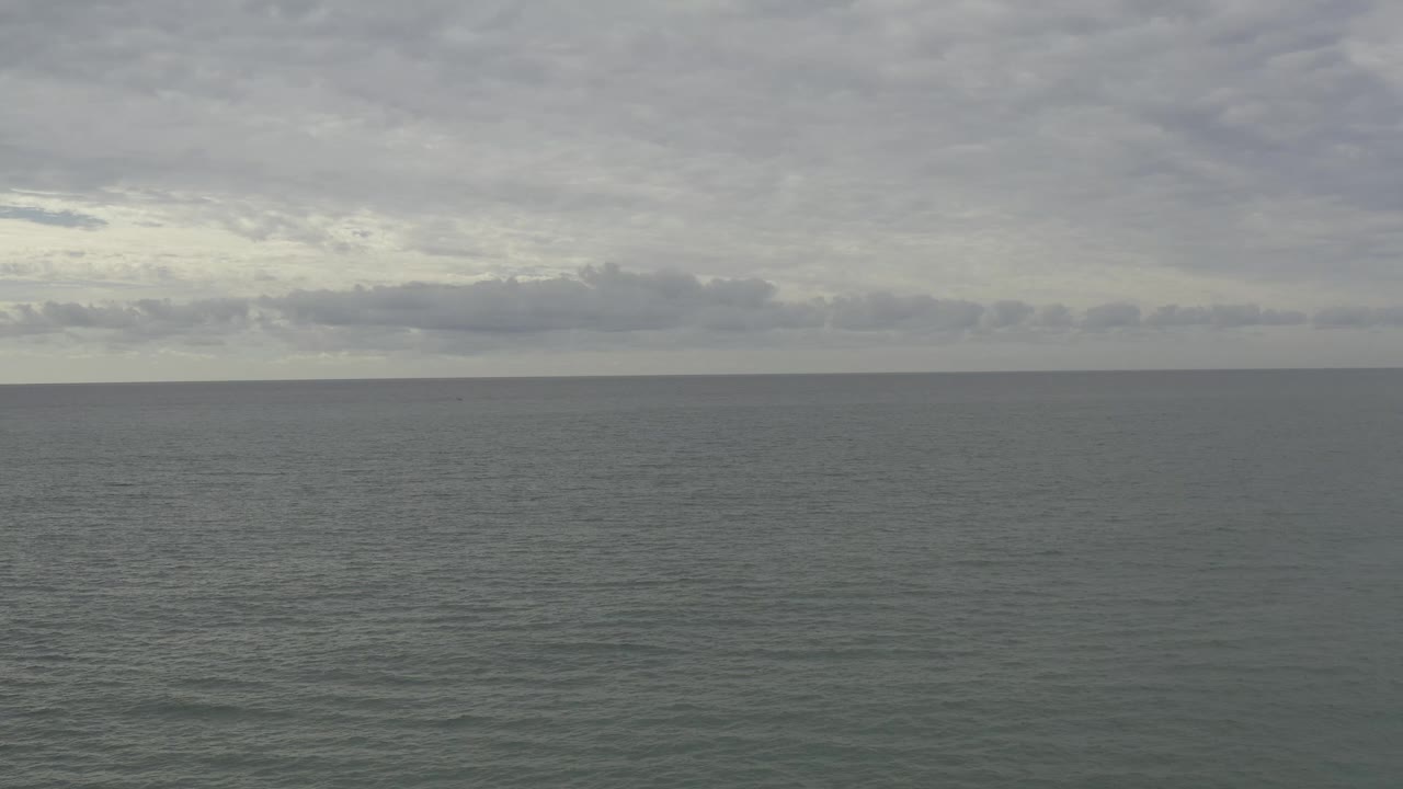 Flat sea horizon with rippled water