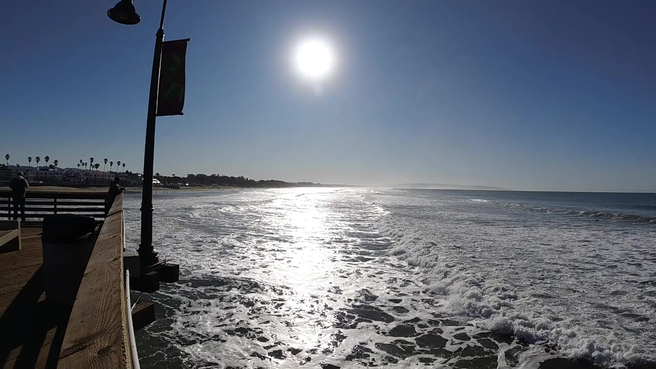 Foamy wave line under strong sun glare