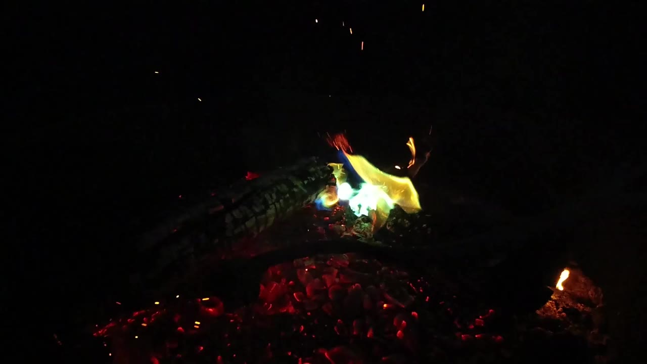 At 0:00, green-yellow flame burns over red embers and a dark log in the San Clemente 2019 clip, with no visible people.