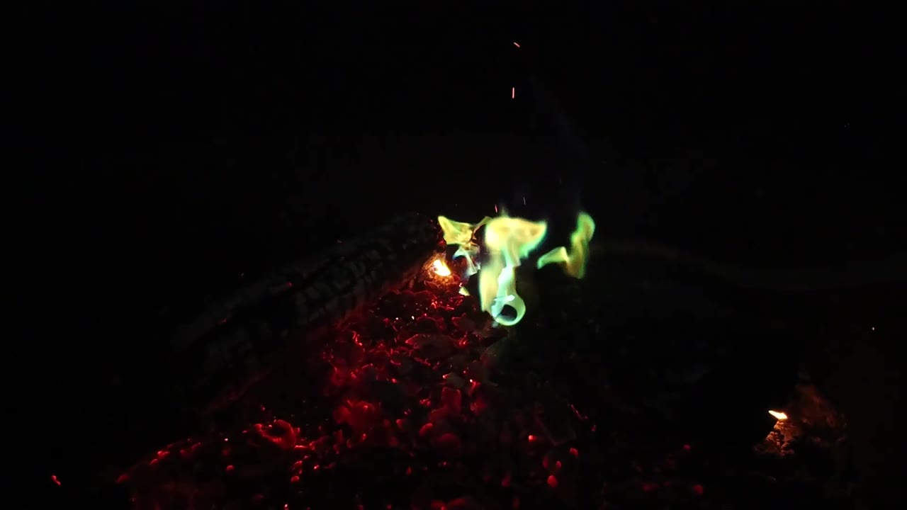 At three seconds in the San Clemente footage, the flame stretches sideways above the red ember bed while a small orange glow appears to the lower right, with no visible people.