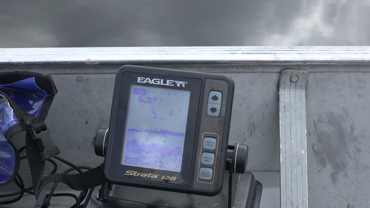 Boat-mounted Eagle monitor under gray storm clouds
