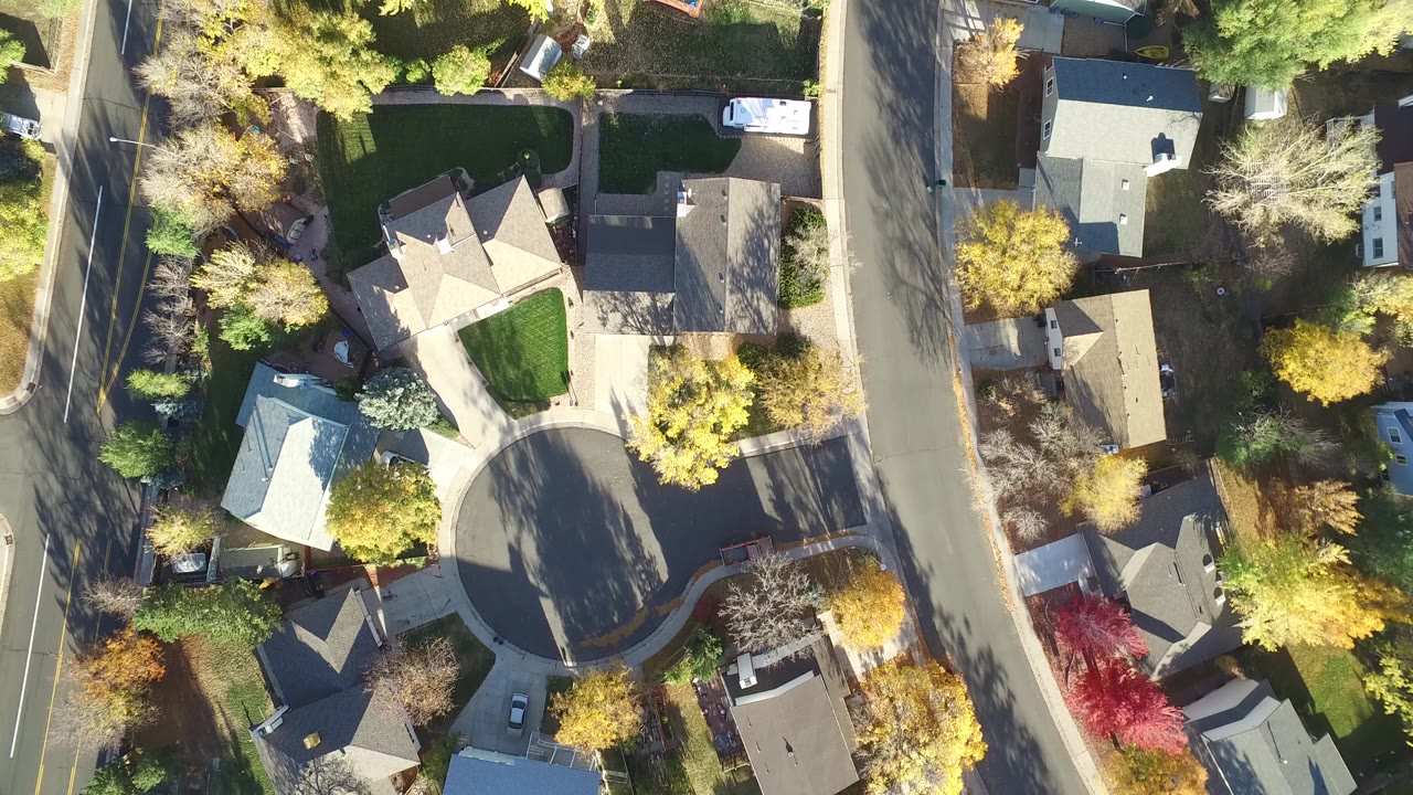 Overhead view of a residential cul-de-sac and nearby streets.