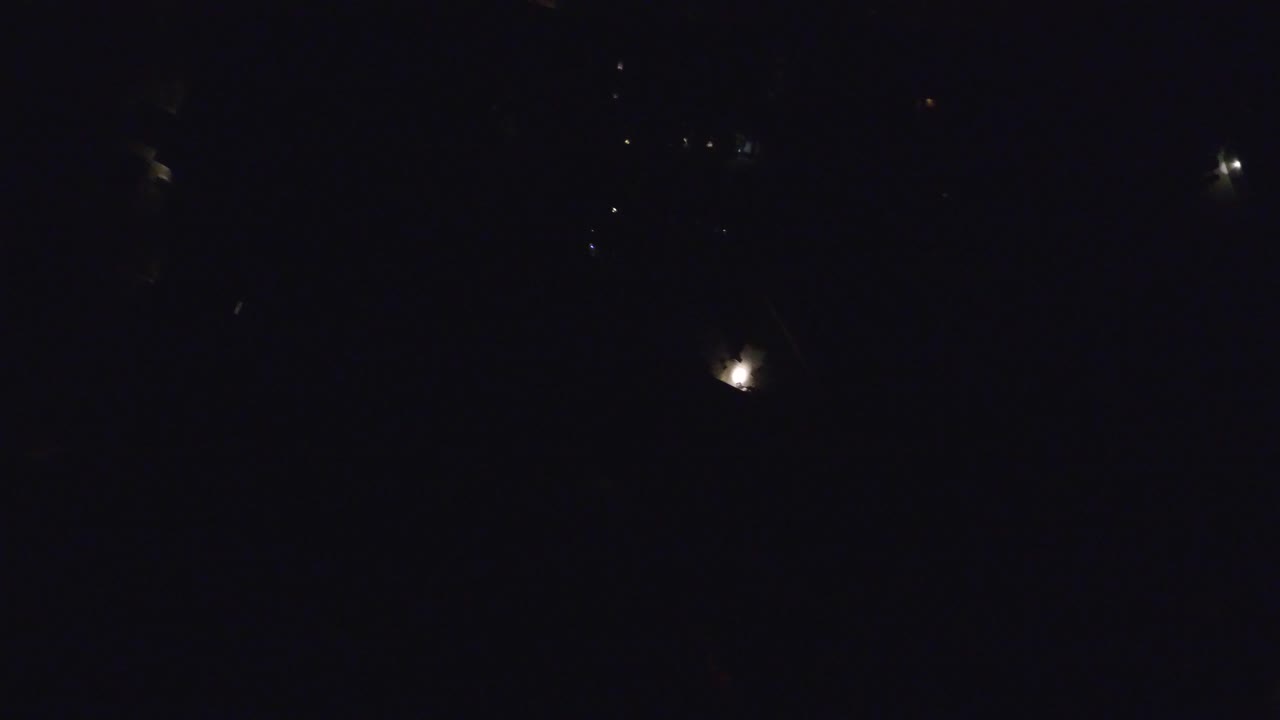 At 0:00, the Hidden Lake Colorado frame is almost black, with a few small bright star-like points scattered across the upper area and no visible people.