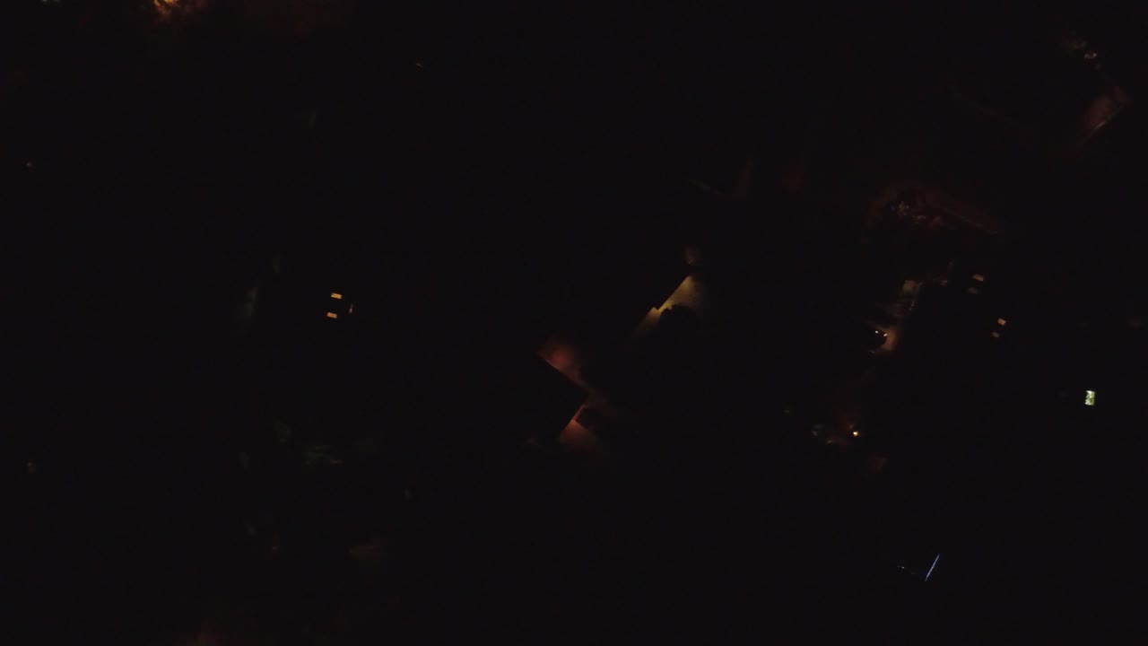Nearly black night frame with tiny warm lights