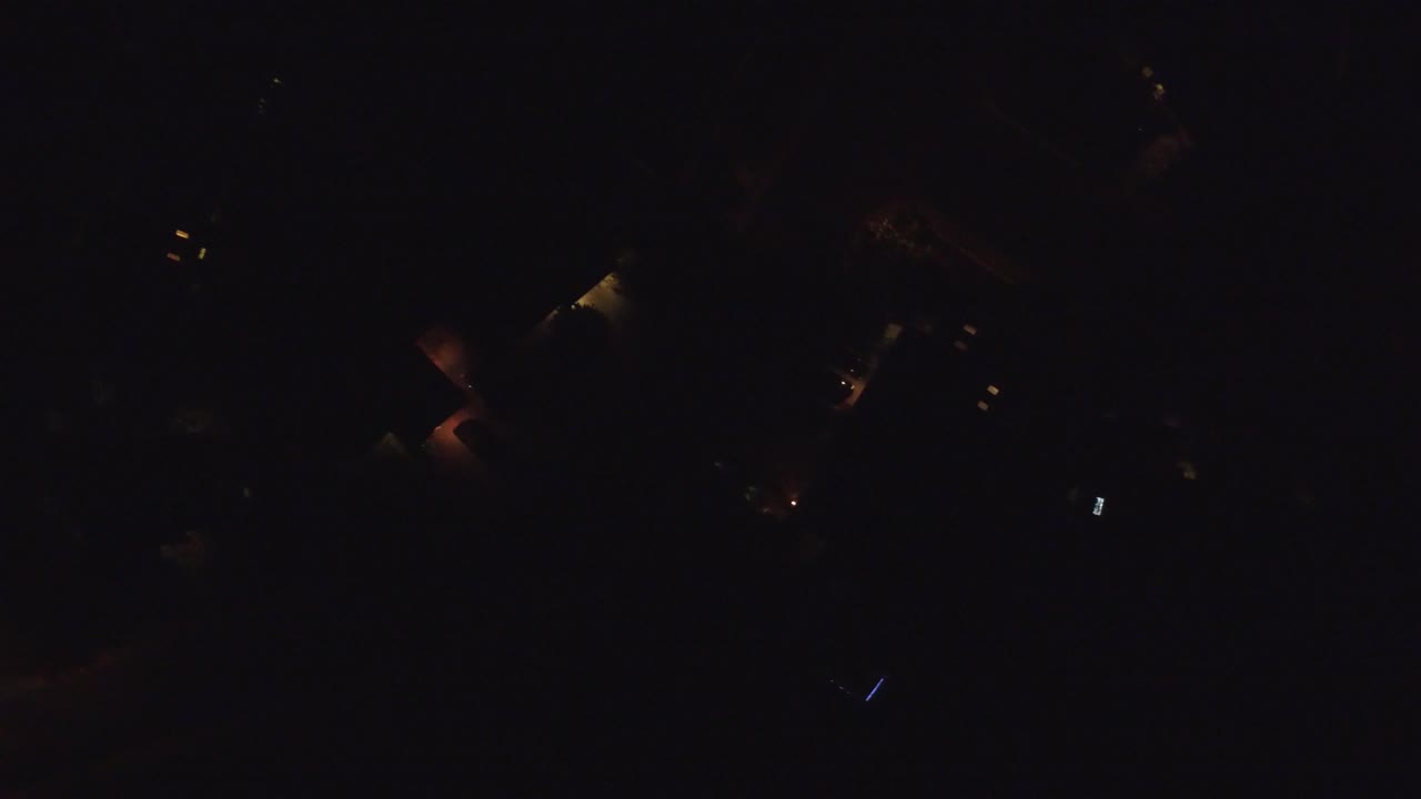 At 0:00, Hidden Lake, Colorado appears as a nearly black night view with several dim warm light points and no visible people.