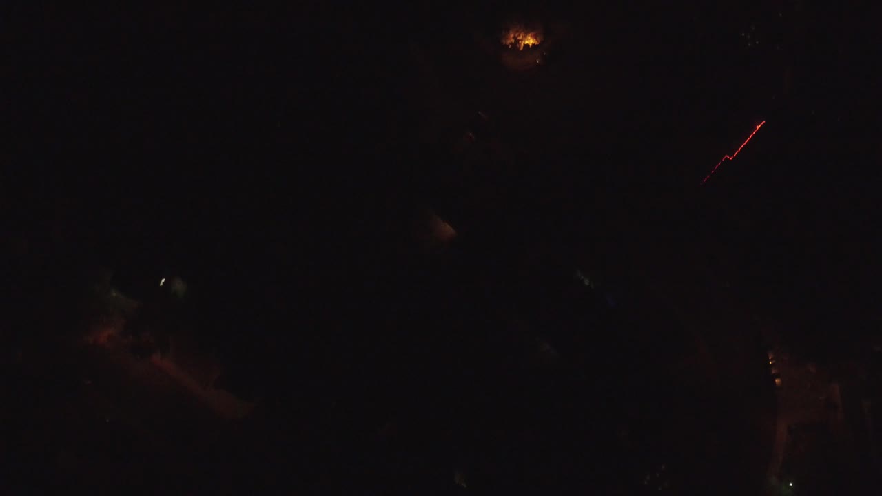 Dark overhead roads with a red diagonal light streak