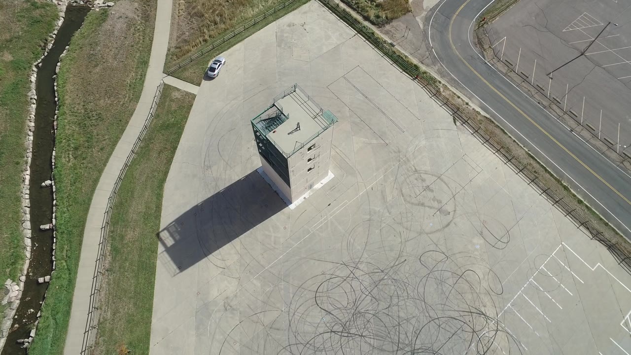 Aerial view of tower beside road and water channel