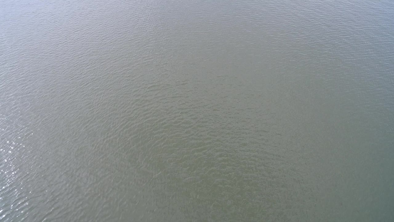 Open water surface with soft blue-gray light