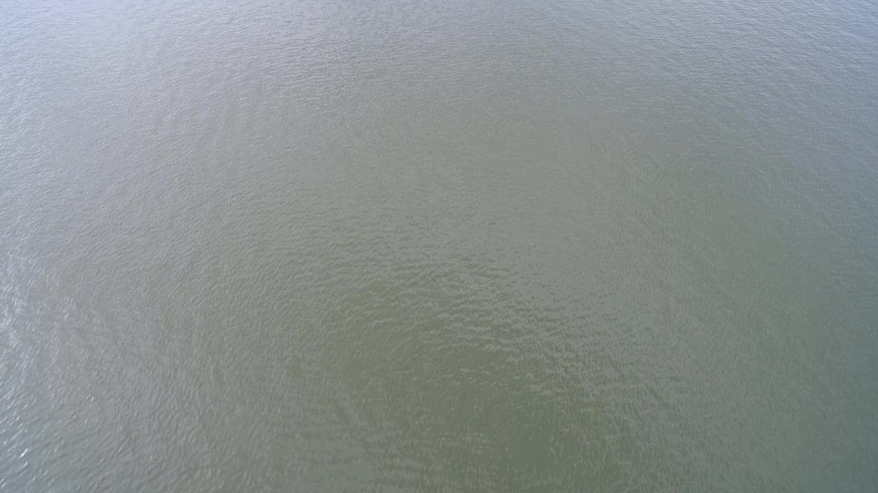 Blue green water surface with subtle wave texture