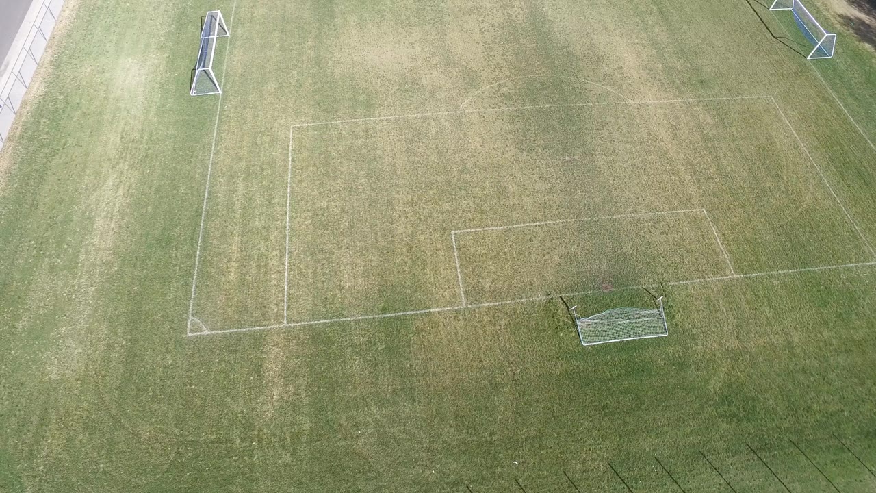 Top-down field view with goal and sideline path