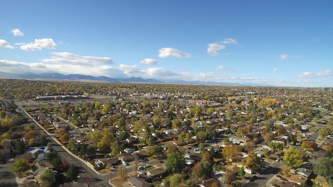 Aerial view of a residential neighborhood under blue sky
