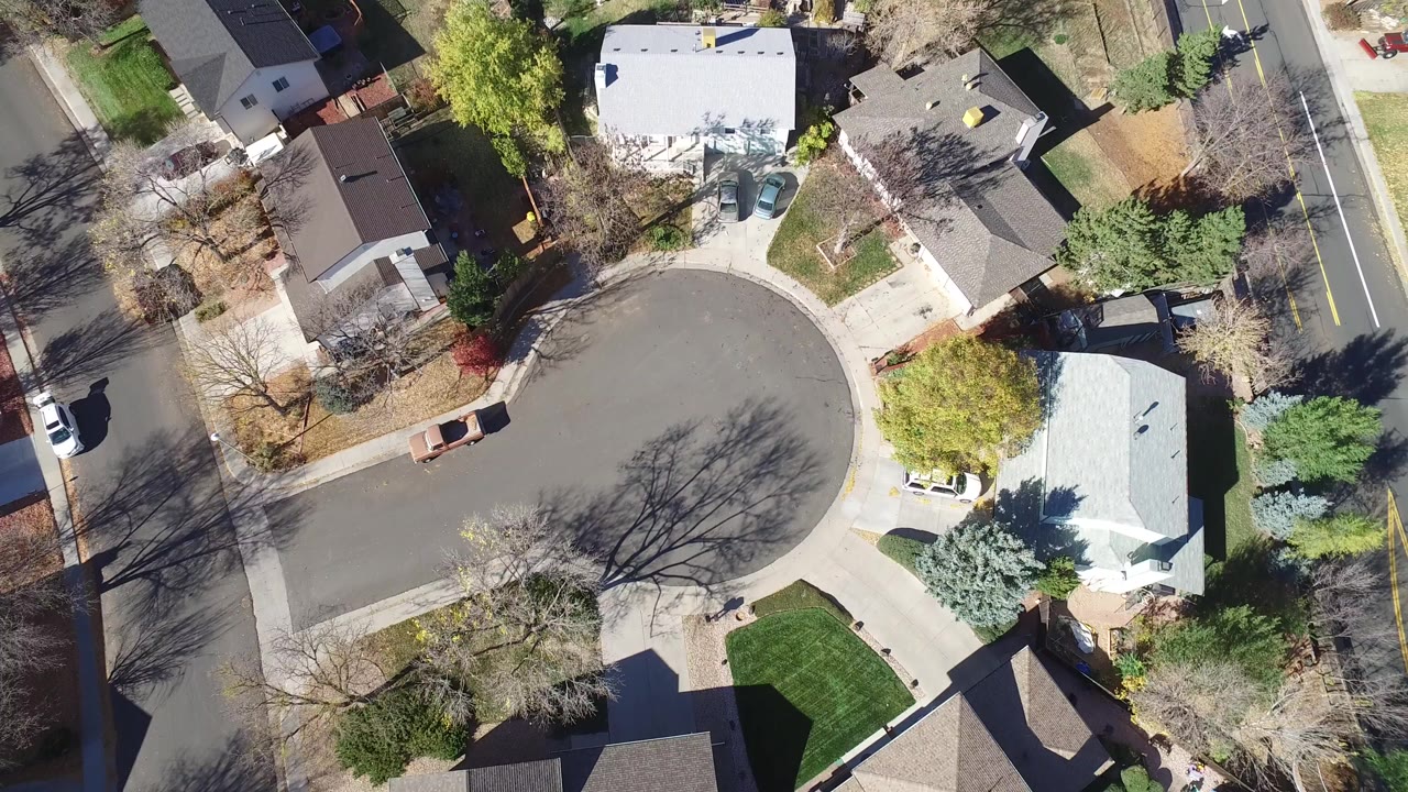 Overhead view of a residential cul-de-sac and surrounding homes.