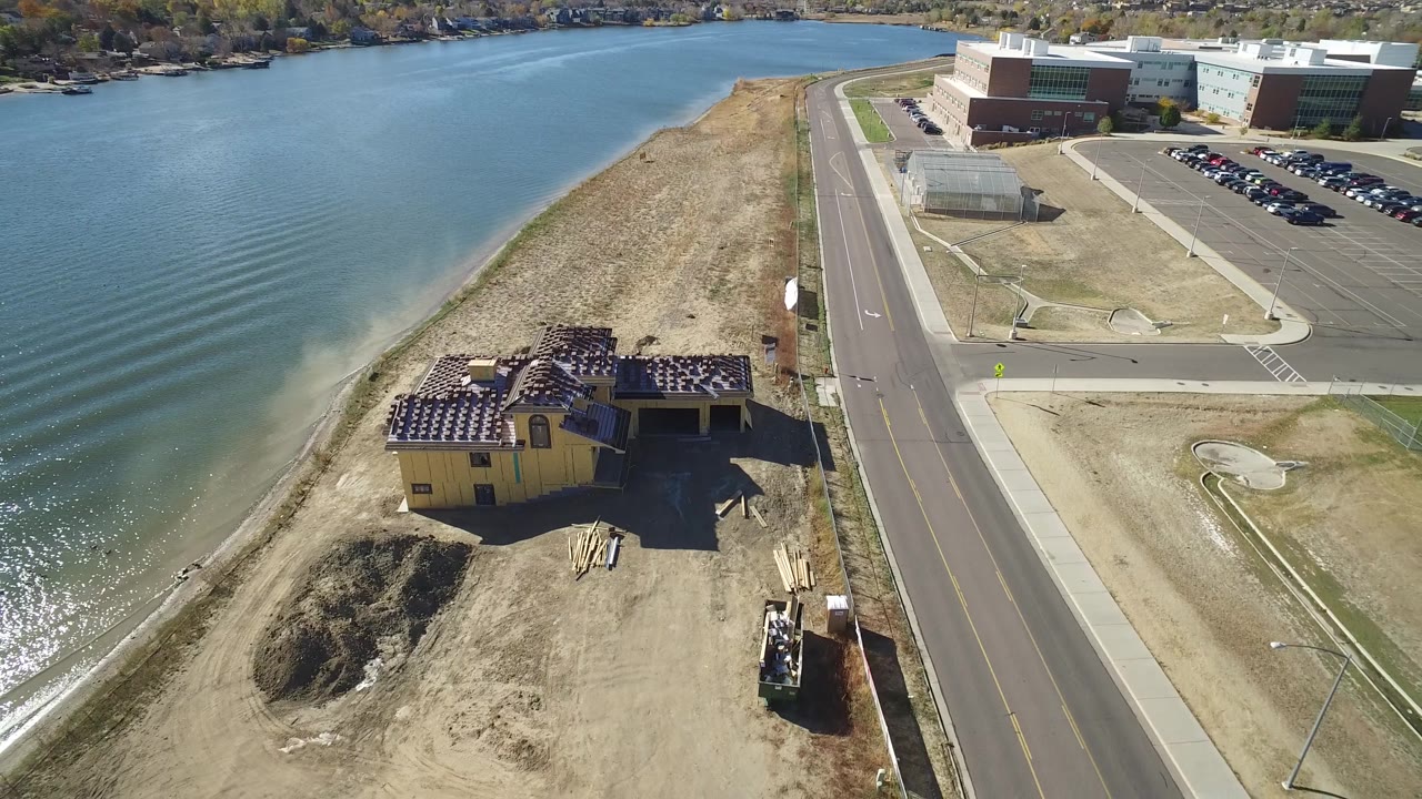 Lakeshore road and construction site seen from above.