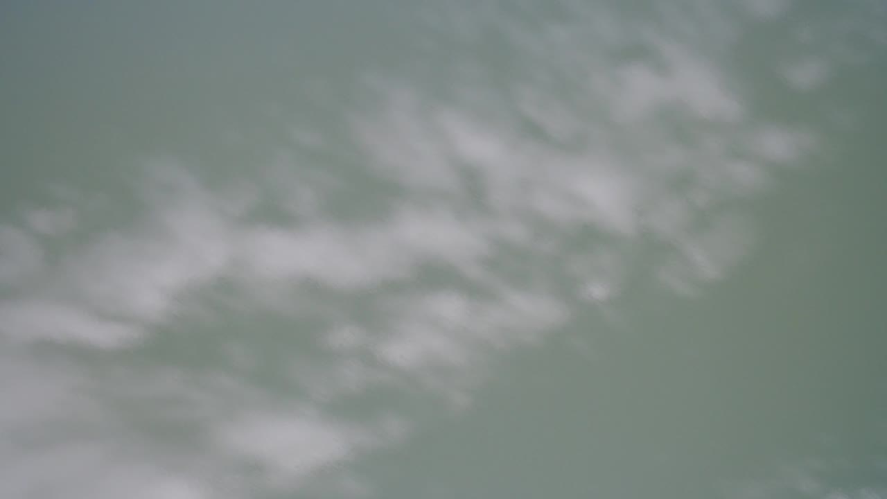 Blurred cloud bands sit slightly higher in the Hidden Lake Colorado frame, with the image still soft and no visible people.