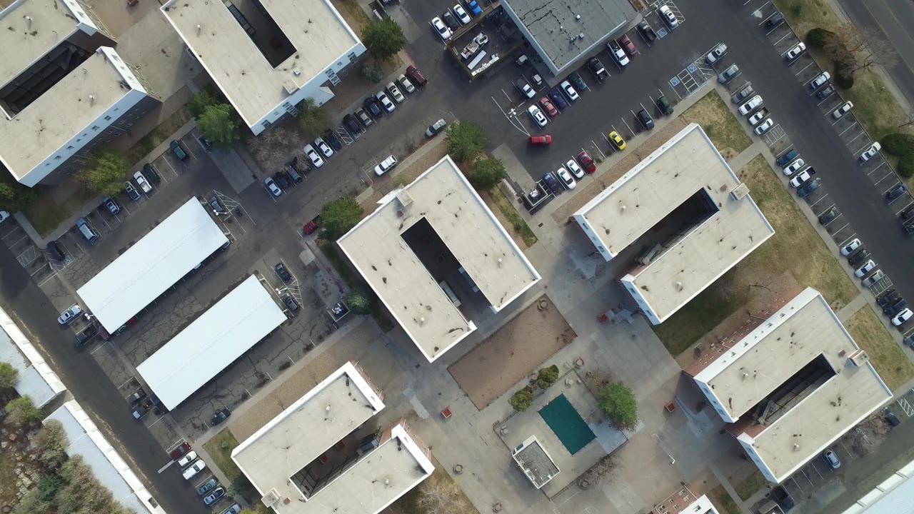 Overhead view of office buildings and parking lots.