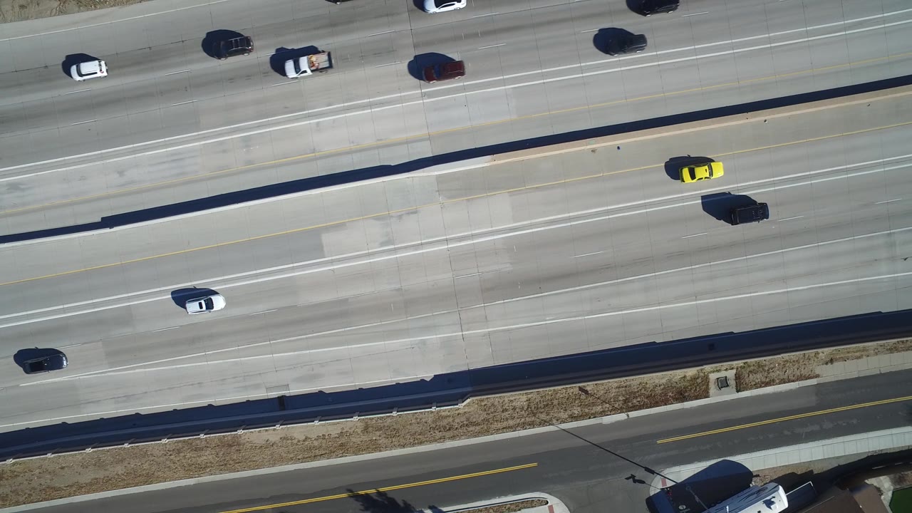 Aerial highway view with cars across multiple lanes