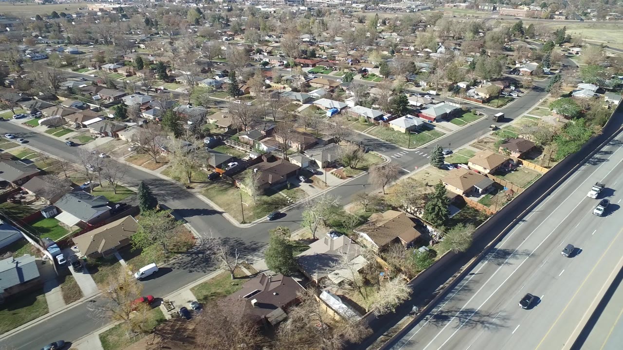 Aerial view of homes beside a multi-lane road