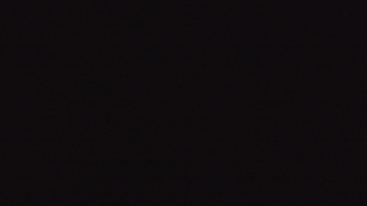 At 0:01, the Denver 2016 image remains very dark, with faint mottled texture visible across the frame and no visible people.