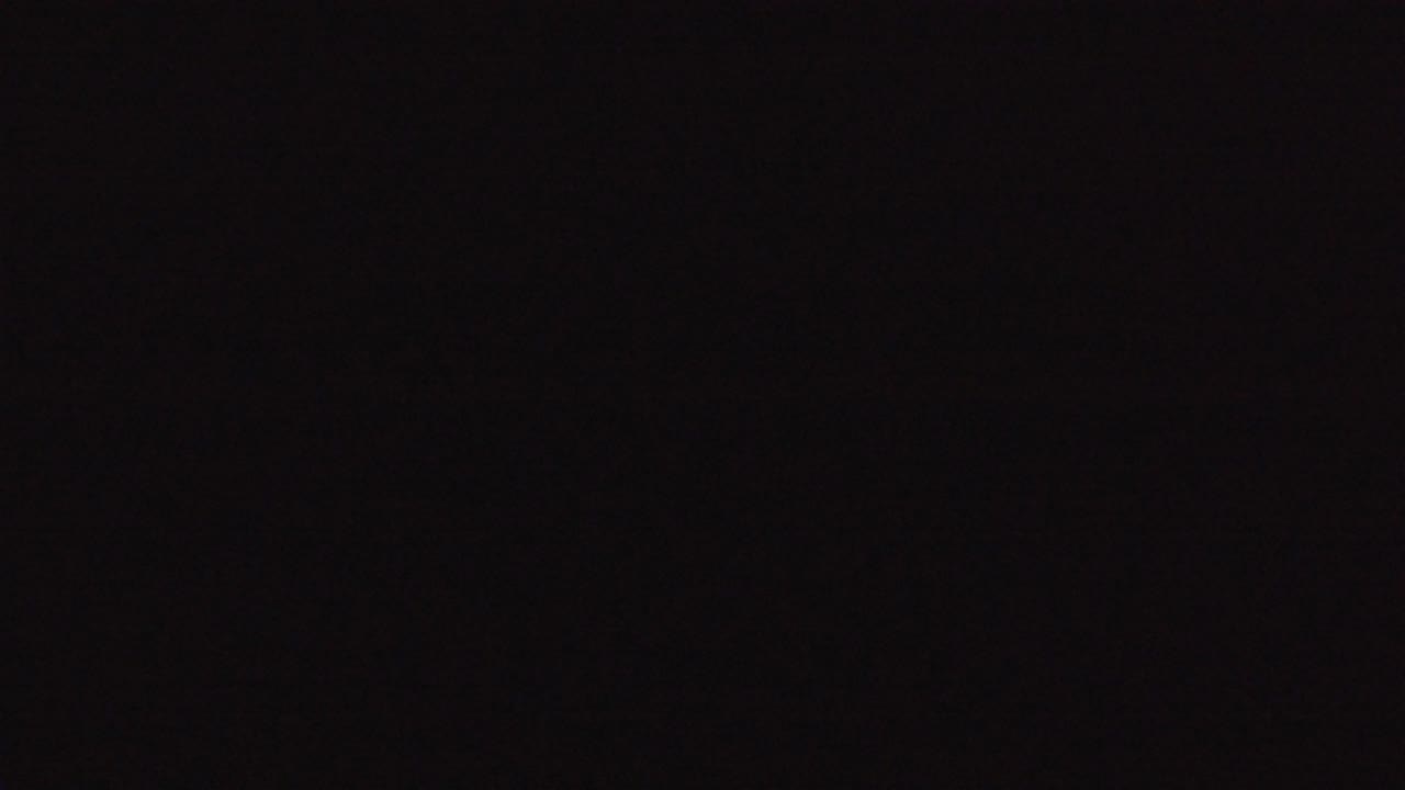 Nearly black frame with faint dark noise
