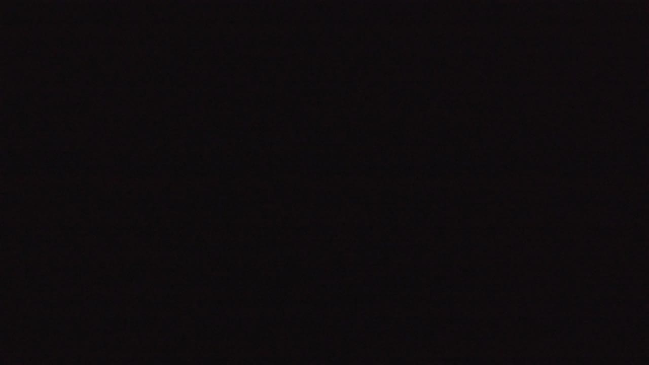 Dark Denver 2016 frame with a mostly black field, slight grain, and no visible people or objects.