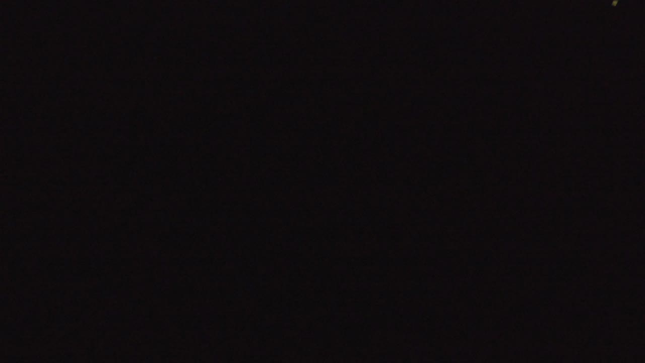 Second frame from the Denver 2016 clip showing a dark, indistinct screen with slight tonal variation and no visible people.
