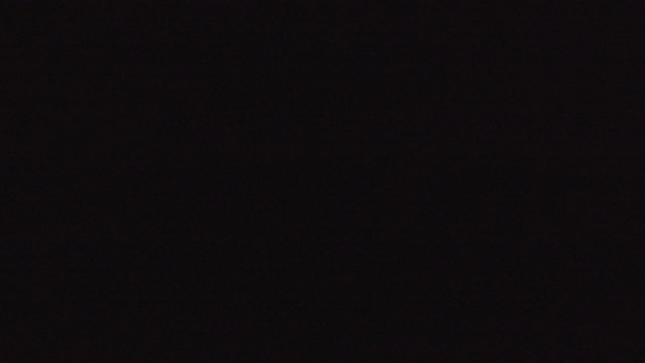 Opening frame from the Denver 2016 clip showing a nearly black screen with faint sensor-like texture and no visible people.