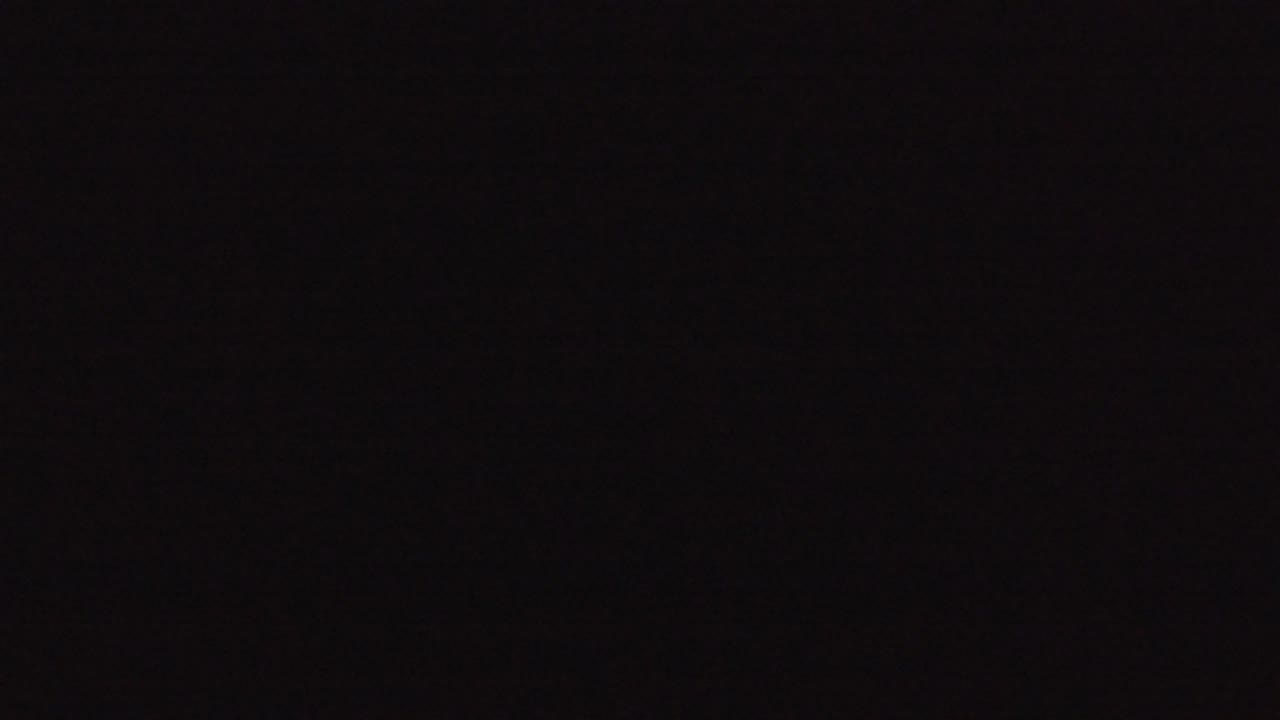 At 0:01, the Denver night footage remains almost fully dark with no readable buildings, people, or signage visible.