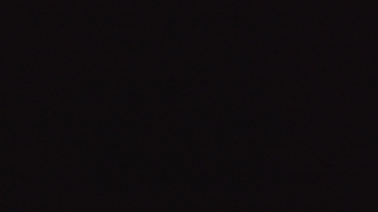 At 0:01, the frame remains a dark empty screen with no subjects, text, location detail, or visible people.