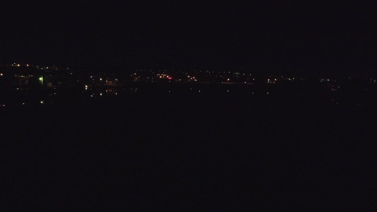 Sparse illuminated buildings in a dark city view