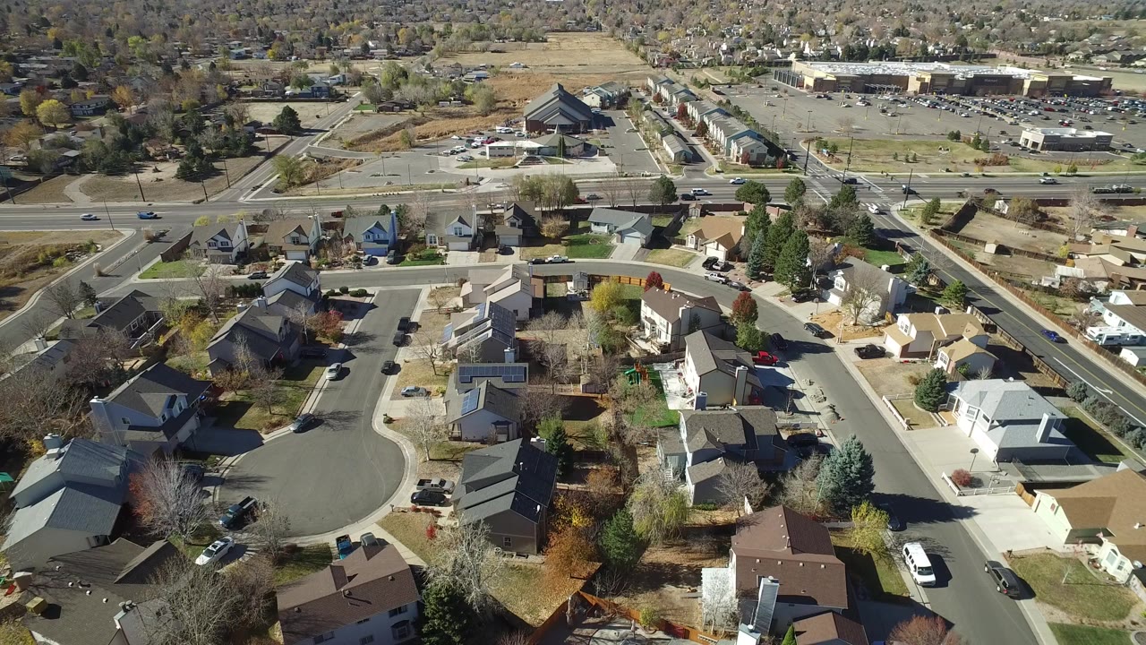 Aerial view of homes and roads in a small residential town.