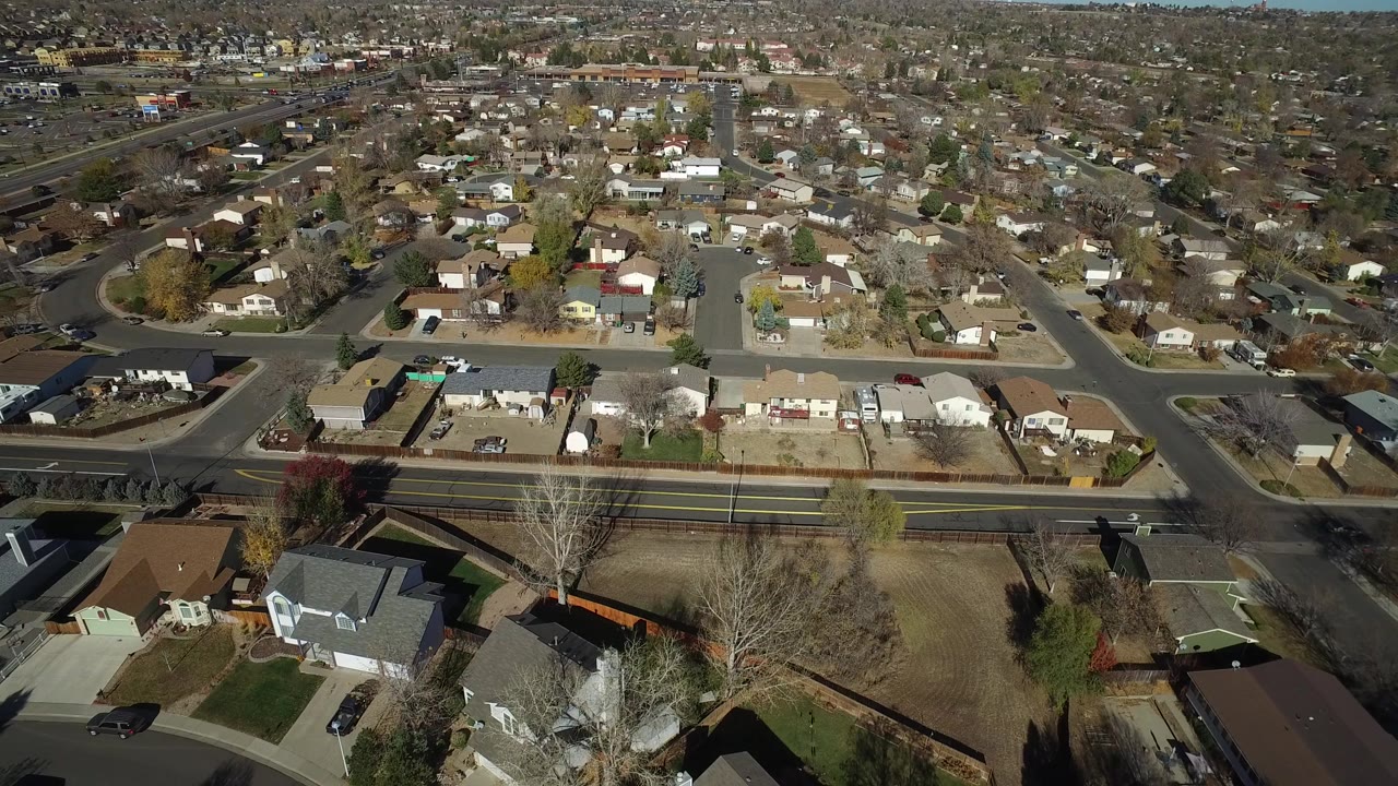 Aerial view of suburban houses and streets.